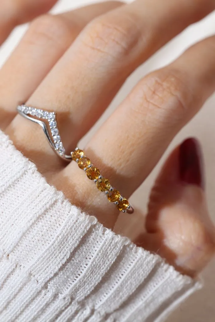 A model wearing the Citrine Half Eternity Band