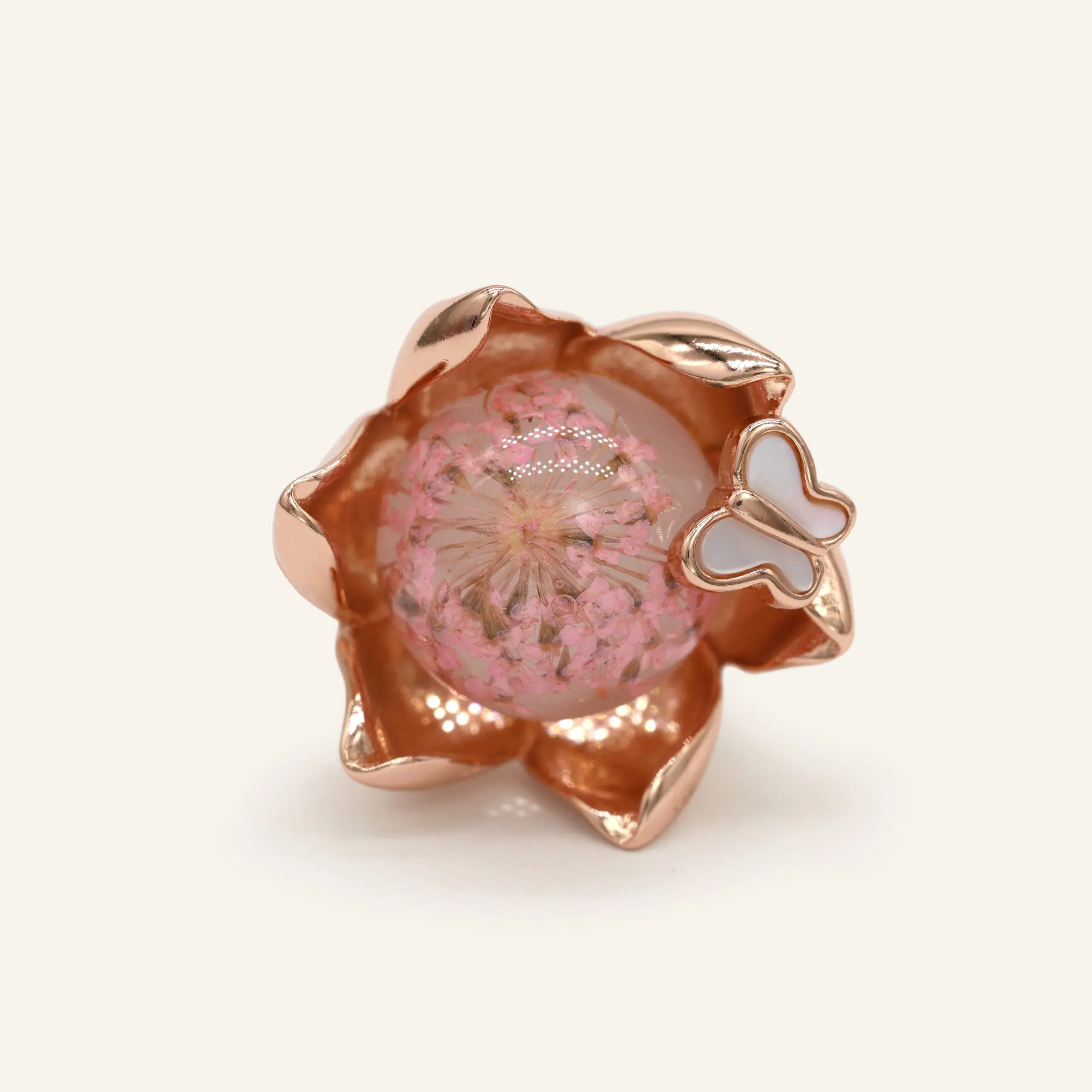 Close-up of a rose gold eternal bloom ring with sakura-like flowers