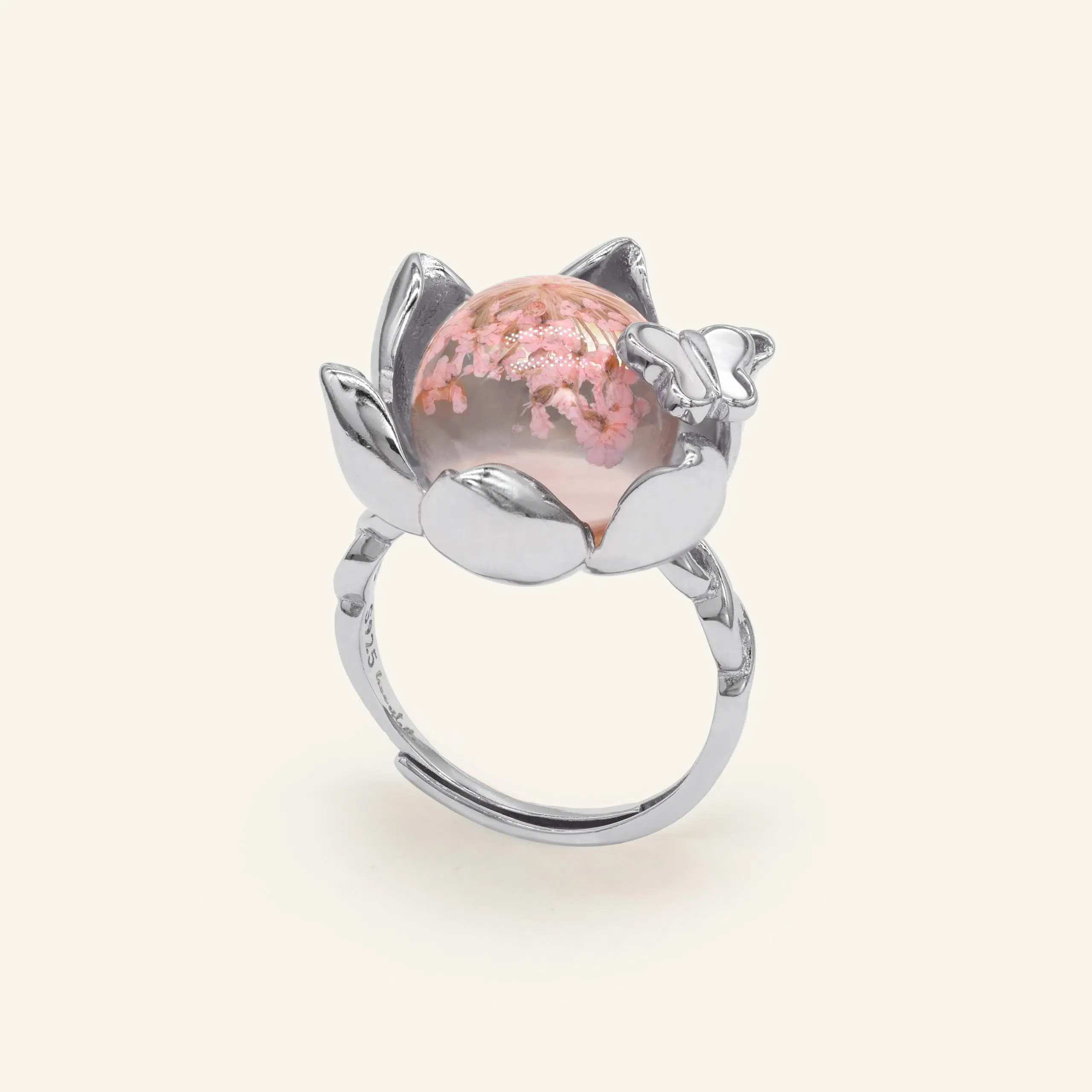 Close-up of a silver eternal bloom ring with sakura-like flowers