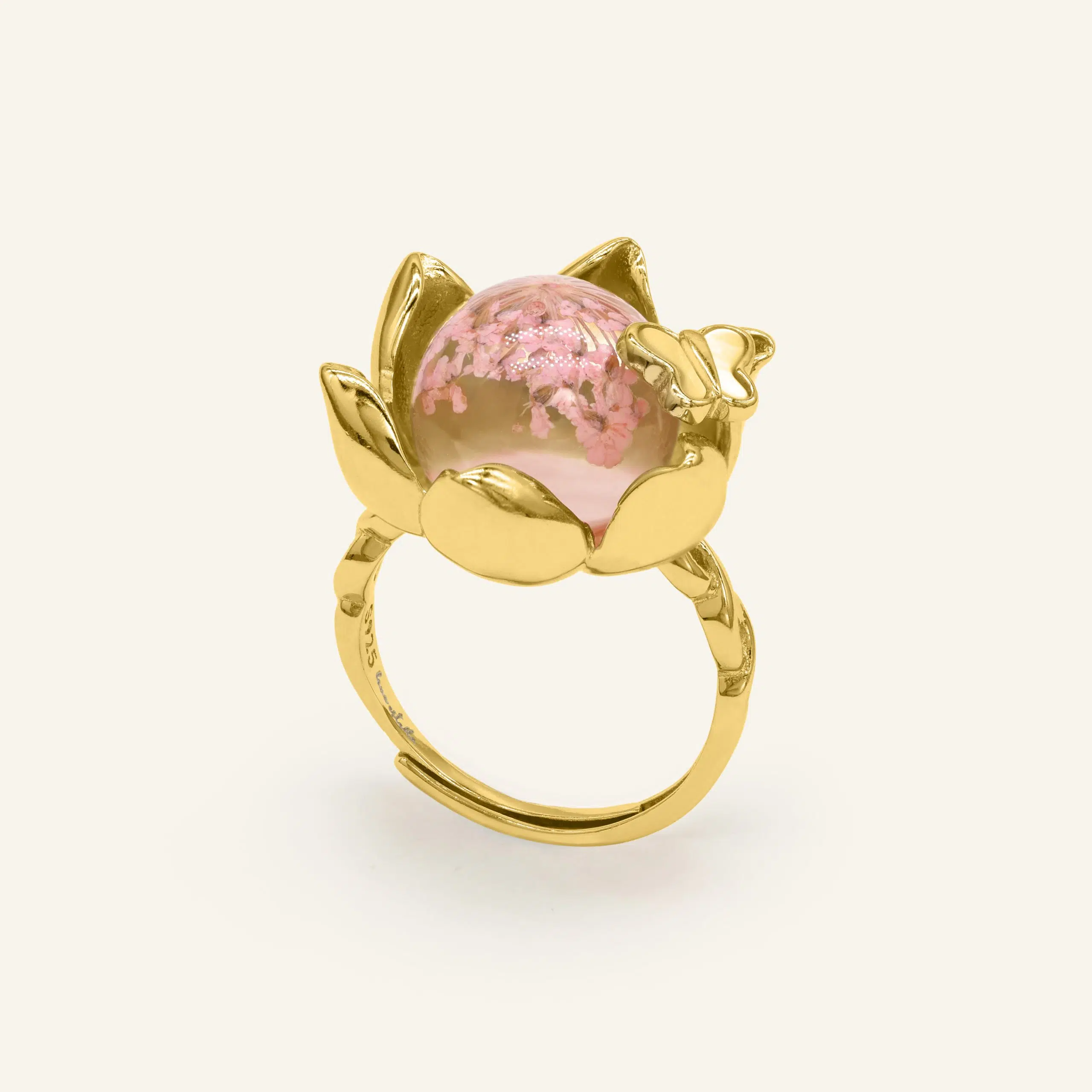 Close-up of a yellow gold eternal bloom ring with sakura-like flowers