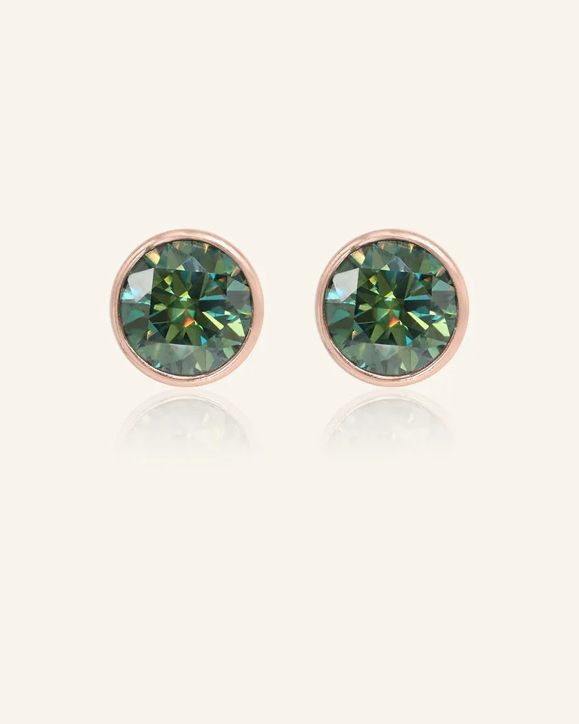 A pair of elegant earrings, each featuring a one carat green moissanite stone set in a bezel rose gold setting.