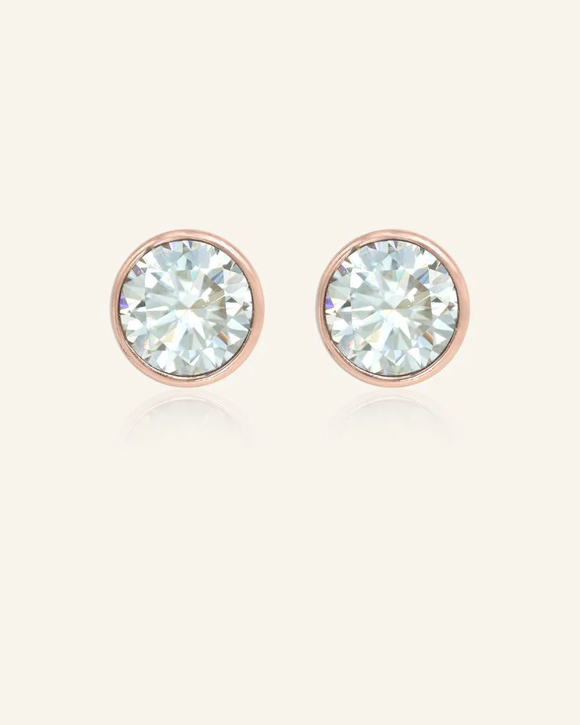 Elegant 1-carat Snow Blue Moissanite bezel studs set in rose gold, showcasing a brilliant icy sparkle and timeless design.