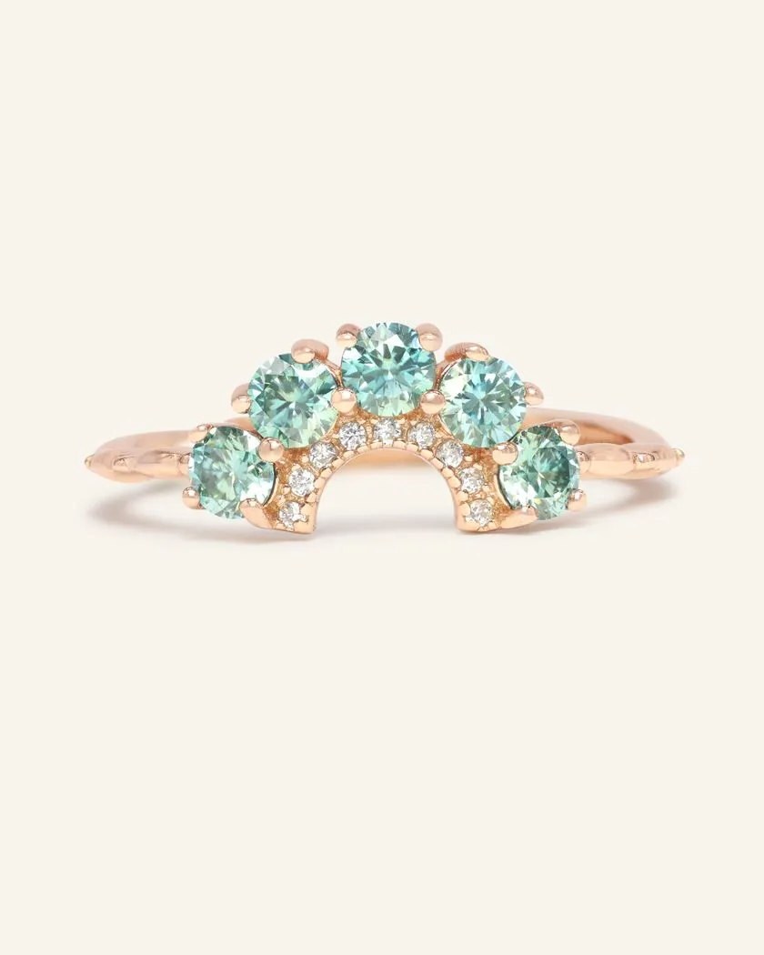 Arc Green Moissanite Ring in rose gold featuring a delicate arc design set with brilliant green moissanite gemstones.