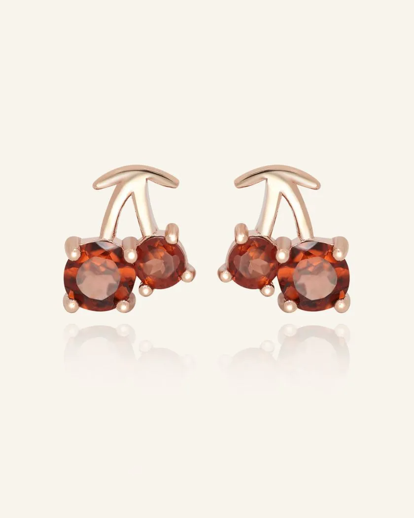 Cherry Garnet Studs – Delightfully crafted in rose gold, these earrings feature rich red garnet gemstones, resembling sweet cherries for a playful yet elegant touch.