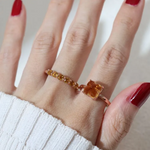 A model wearing the Citrine Half Eternity Band