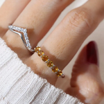 A model wearing the Citrine Half Eternity Band