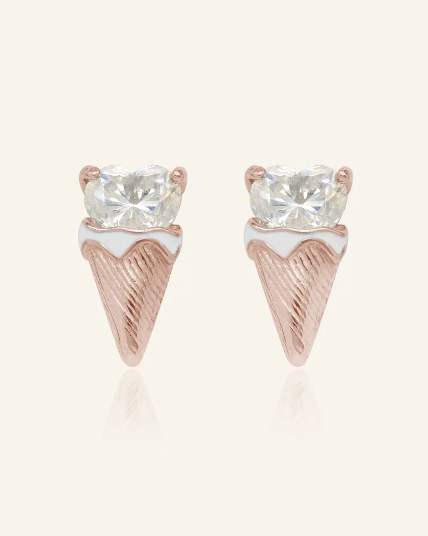 The Creamy Cone Moissanite Studs feature a heart-shaped white moissanite set in rose gold, resembling a delightful ice cream treat. The hand-painted enamel detail on the cone adds a playful touch, making these studs a sweet statement piece.