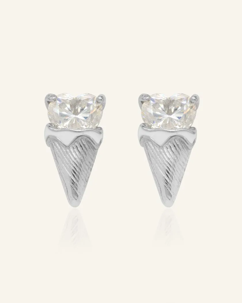 The Creamy Cone Moissanite Studs feature a heart-shaped white moissanite set in silver, resembling a delightful ice cream treat. The hand-painted enamel detail on the cone adds a playful touch, making these studs a sweet statement piece.