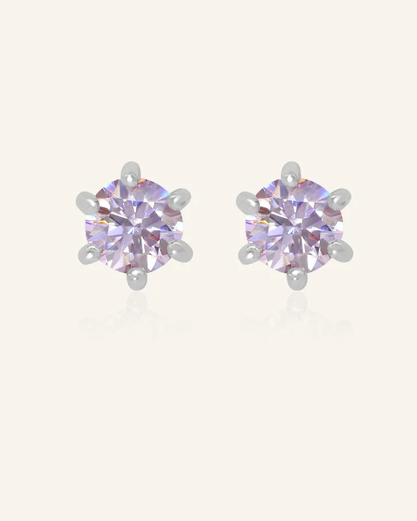 Dainty lilac moissanite studs set in silver, featuring a soft lavender sparkle and a six-prong design for an elegant and timeless look.