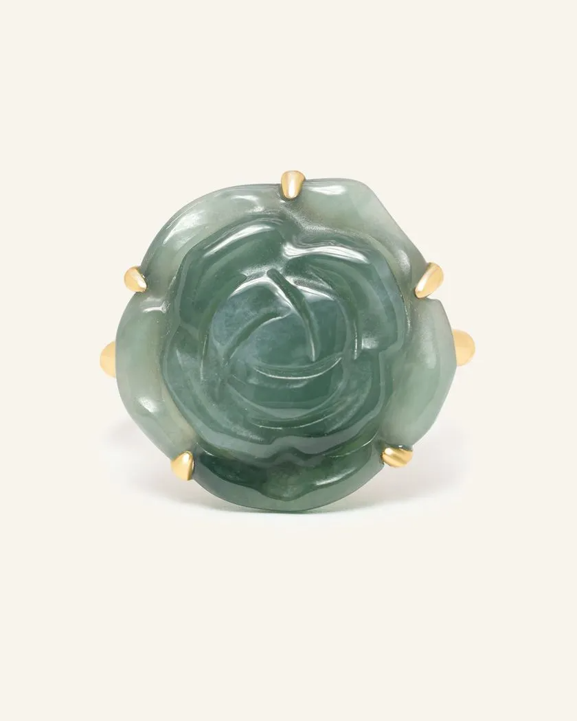 Handcarved jadeite rose ring set in yellow gold, showcasing intricate detailing and natural stone patterns.	
