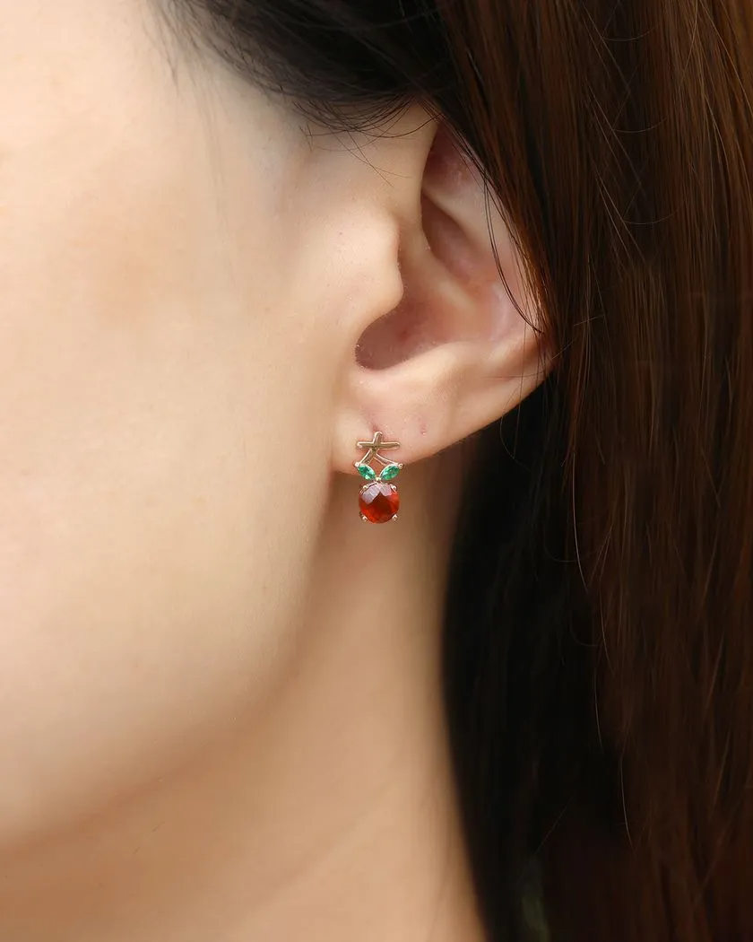 A model wearing the rose gold lucky blessings ear studs featuring asymmetrical designs: one with a round orange Orange Garnet and the other with a pear-shaped Peridot, both accented with green marquise-shaped leaves and a stylized Chinese character symbol for blessings, representing prosperity and good fortune.