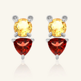 Pooh Origami Studs in silver, inspired by Winnie the Pooh, featuring a whimsical bear design with sparkling garnet and citrine gemstones.