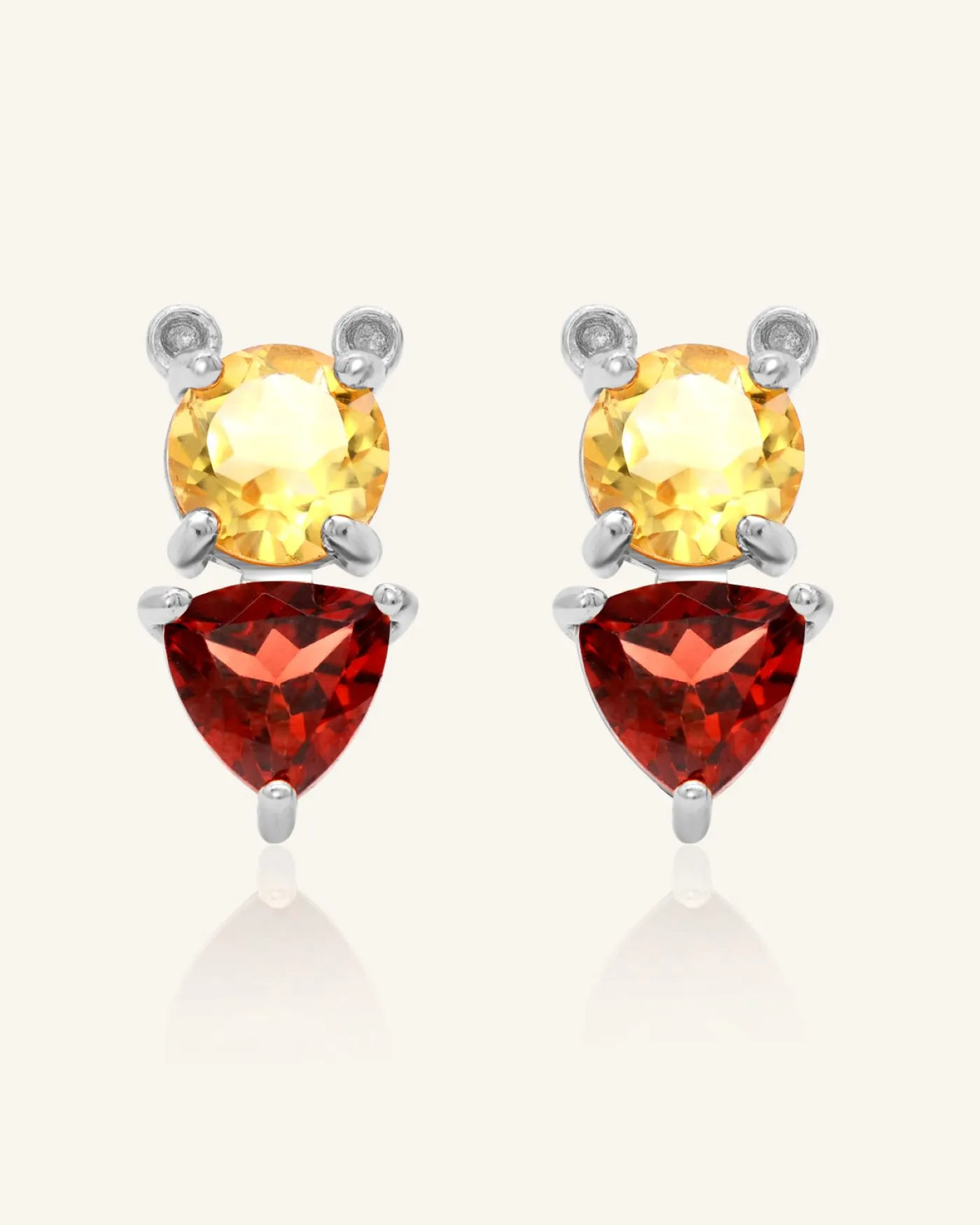 Pooh Origami Studs in silver, inspired by Winnie the Pooh, featuring a whimsical bear design with sparkling garnet and citrine gemstones.