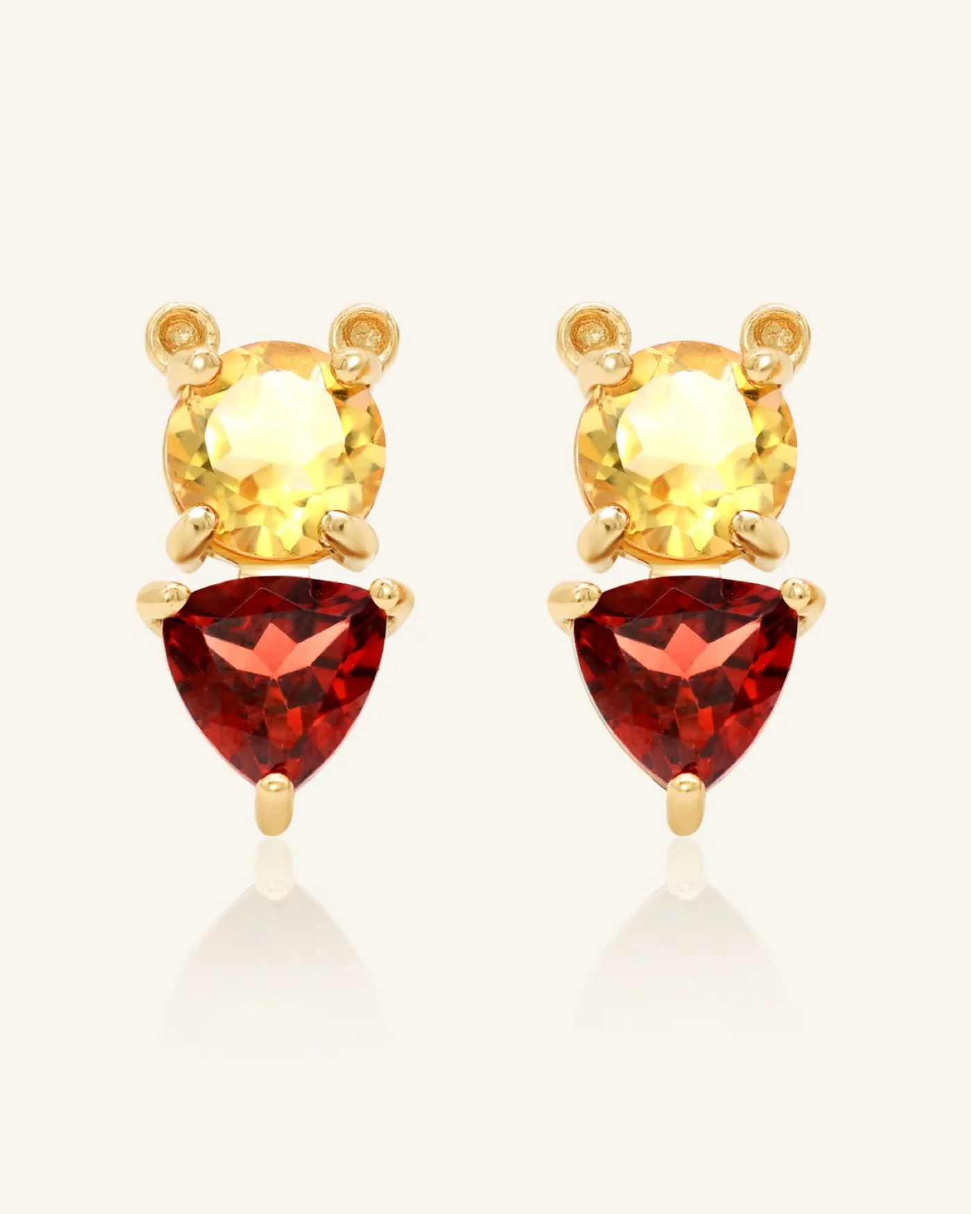 Pooh Origami Studs in yellow gold, inspired by Winnie the Pooh, featuring a whimsical bear design with sparkling garnet and citrine gemstones.