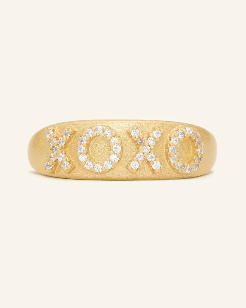 Yellow gold XOXO ring with a matte finish, featuring sparkling cubic zirconia stones set in the letters for a chic and romantic touch.