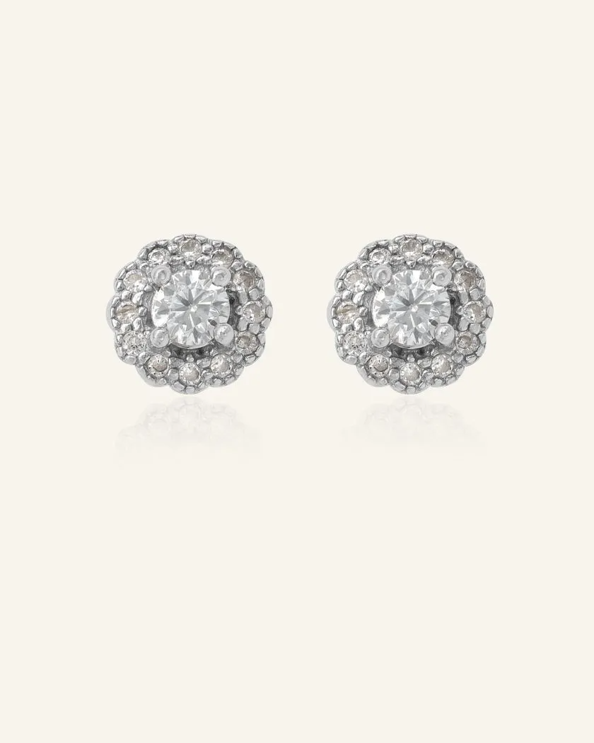 Chrome Grey Moissanite Halo Studs in Silver – Elegant and timeless earrings featuring a sparkling whitish grey moissanite center stone, encircled by a radiant halo of cubic zirconia.