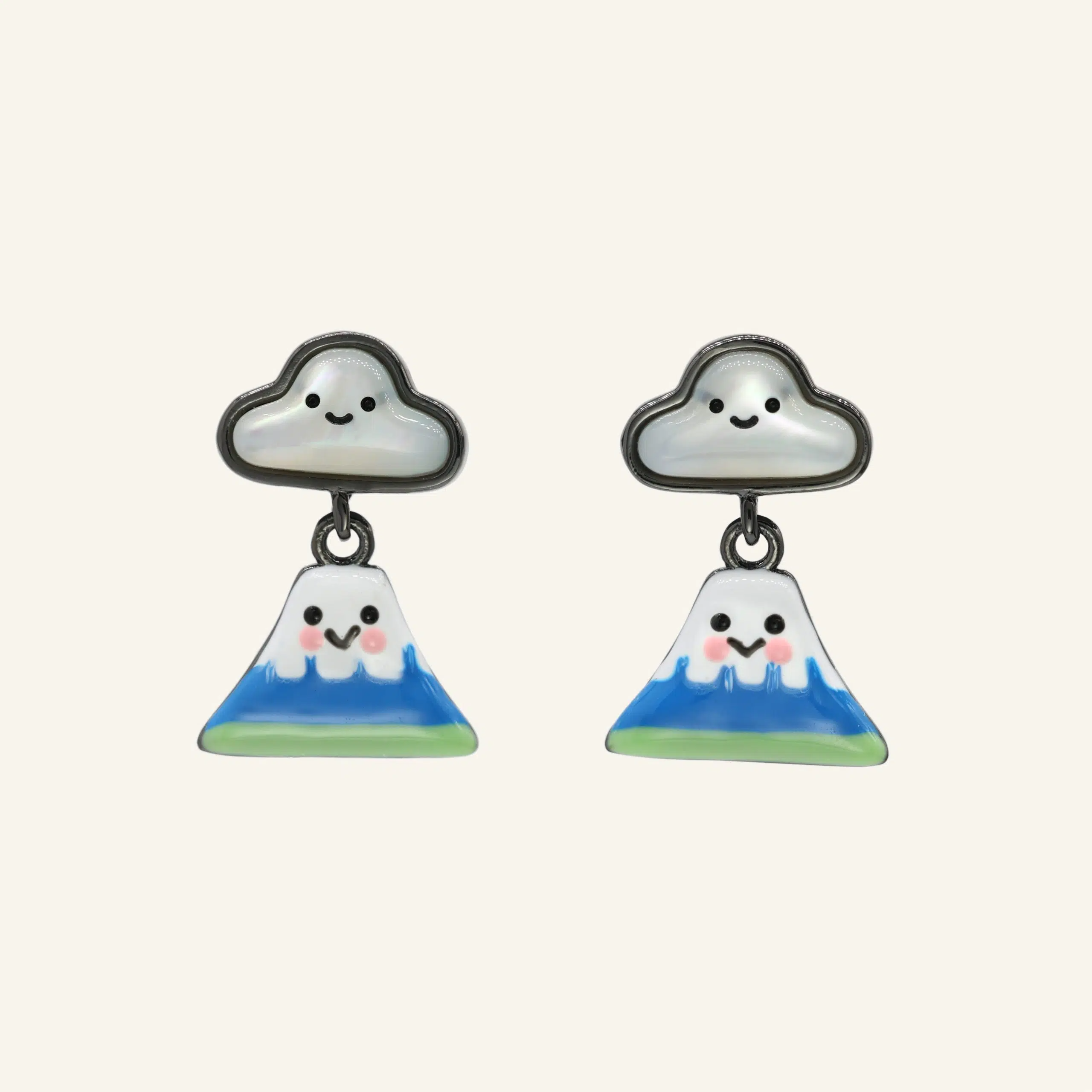 Close-up of a pair of black gold fuji-san cloud mother-of-pearl studs